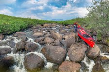 Dragging canoe over rocks.jpg